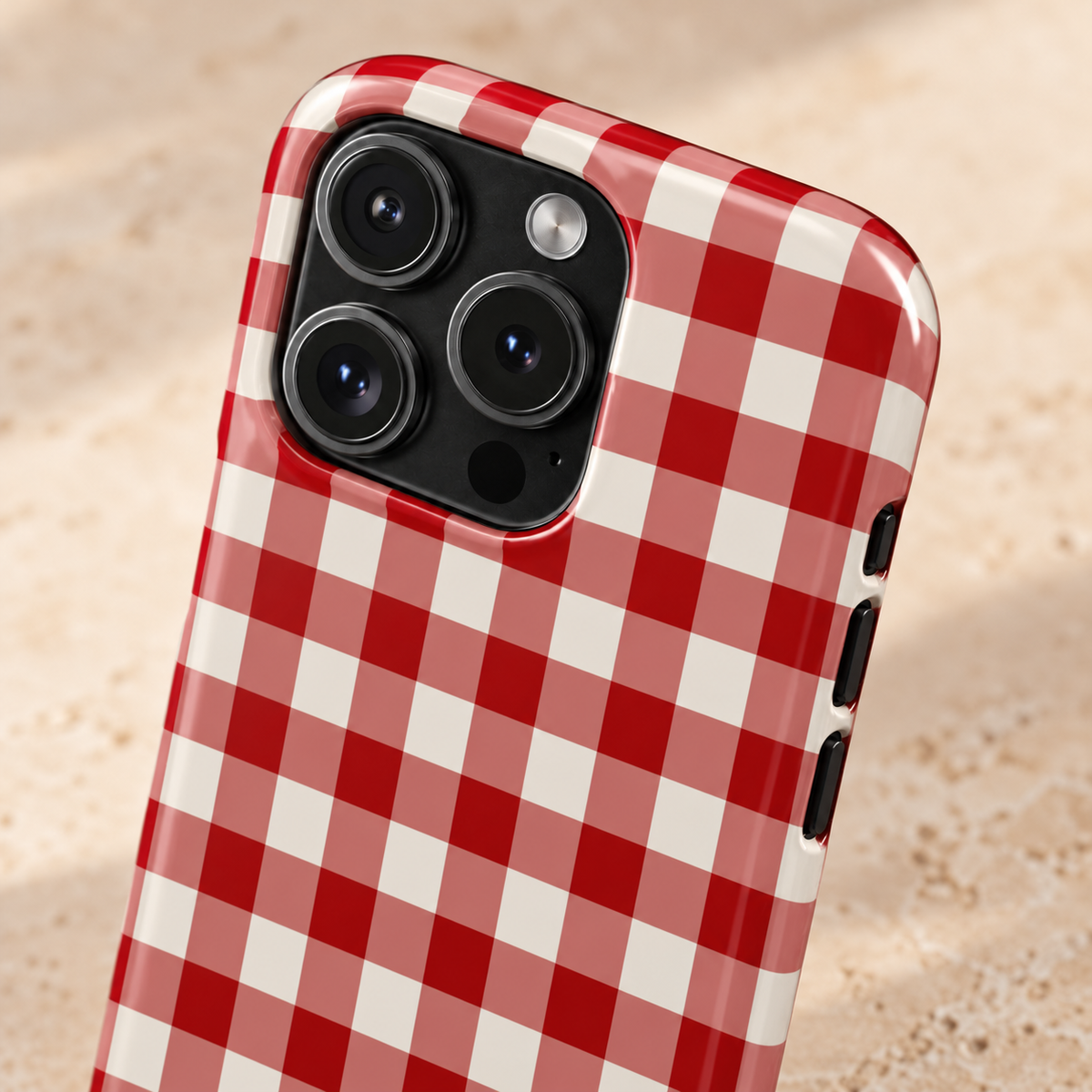 Red Gingham protective phone case, classic red and white gingham, lifestyle close-up of the camera