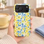Amalfi Lemon protective phone case, yellow lemons and blue leaves on white, lifestyle photo in hand with coffee
