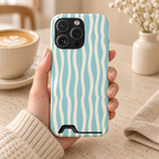 Aqua Wave phone case with card holder, aqua and cream wavy stripes, lifestyle photo in hand with coffee