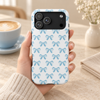 Baby Blue Bow protective phone case, baby blue bows on white, lifestyle photo in hand with coffee