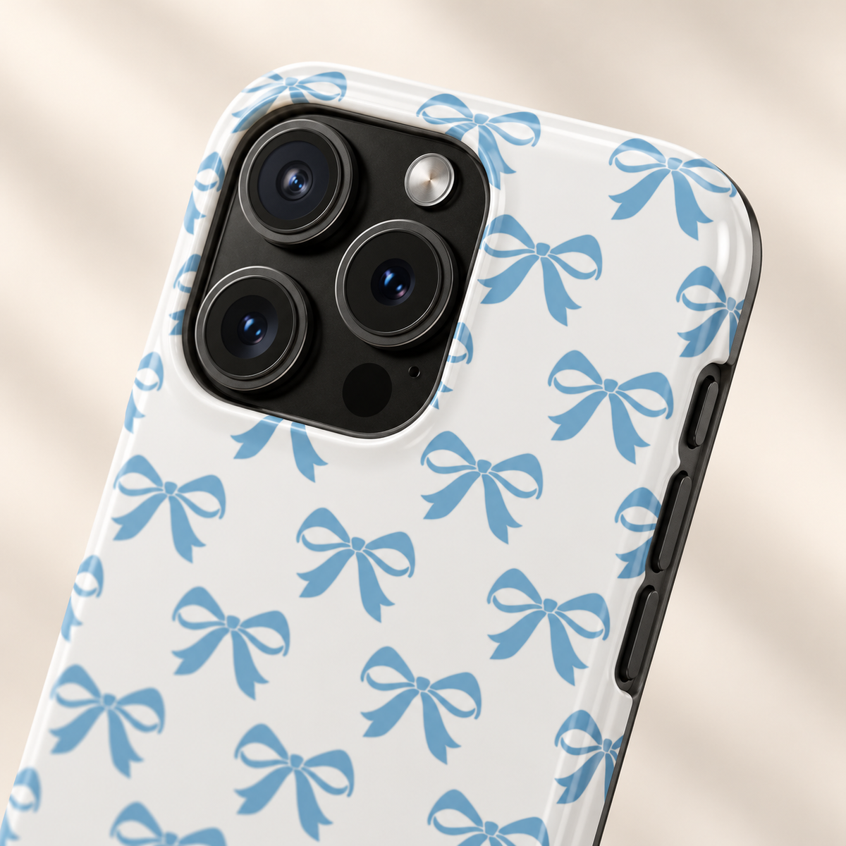 Baby Blue Bow protective phone case, baby blue bows on white, lifestyle close-up of the camera