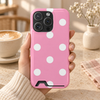 Big Pink Polka Dot phone case with card holder, big white polka dots on pink, lifestyle photo in hand with coffee