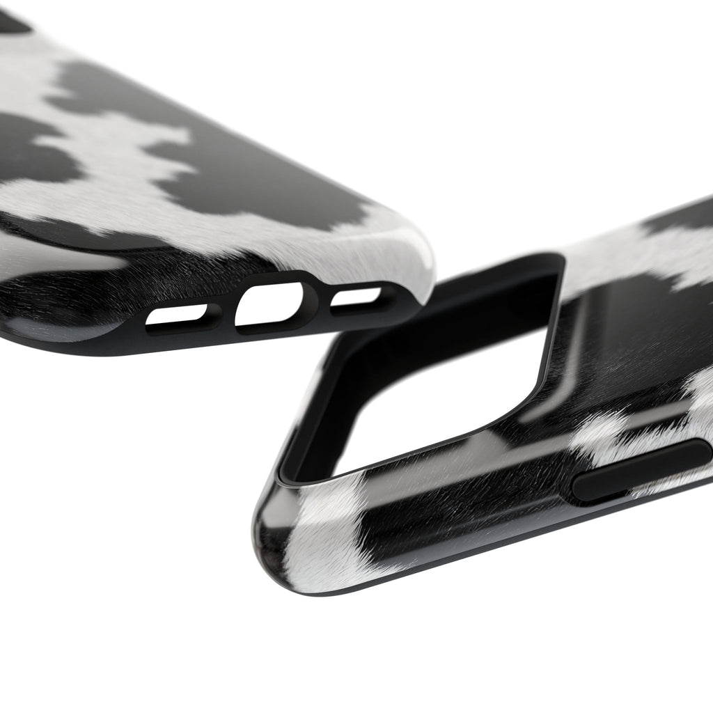 Black Cow Print protective phone case, close-up at an angle