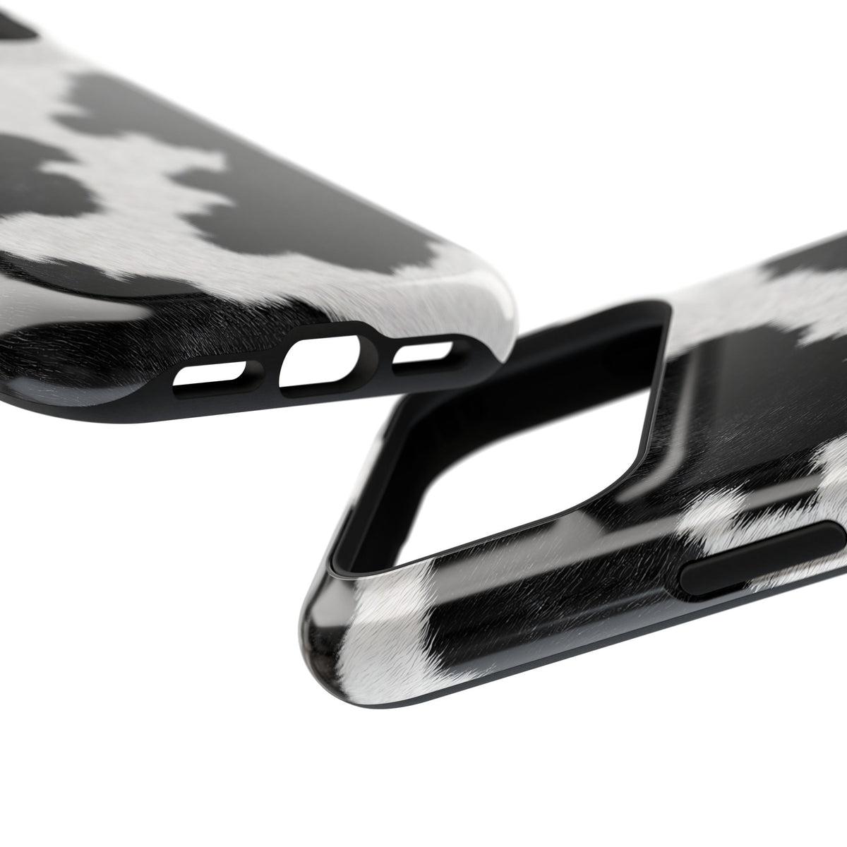 Black Cow Print protective phone case, close-up at an angle
