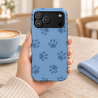 Blue Paw Print MagSafe case, navy paw prints on cornflower blue, lifestyle photo in hand with coffee