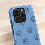 Blue Paw Print phone case with card holder, navy paw prints on cornflower blue, lifestyle close-up of the camera