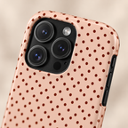 Blush Micro Dot protective phone case, tiny black dots on blush pink, lifestyle close-up of the camera