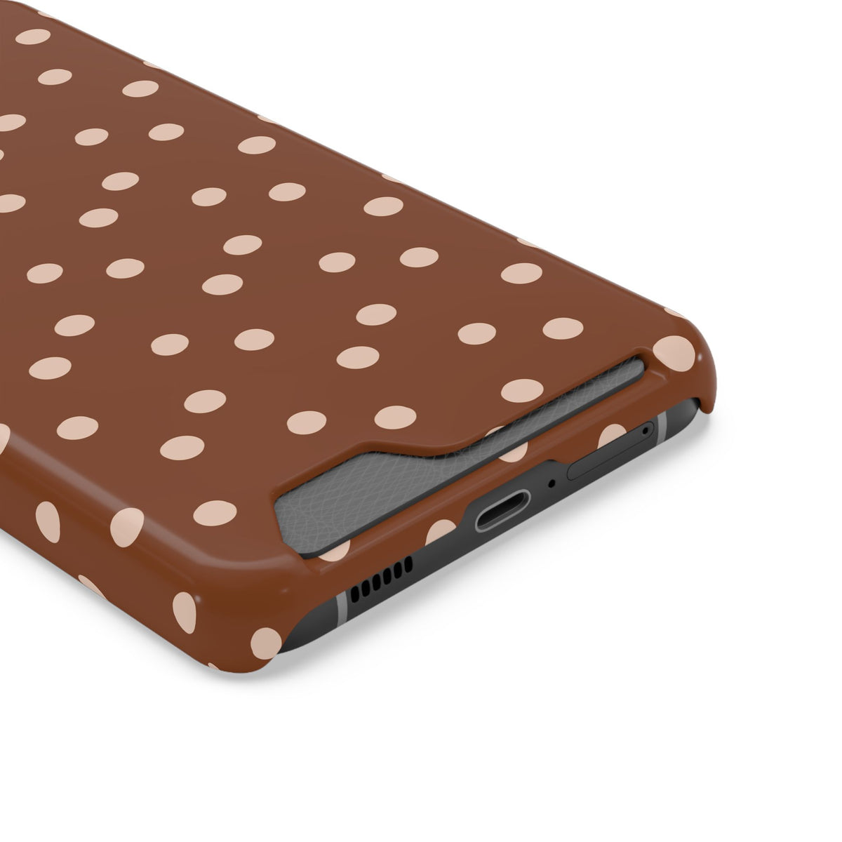 Brown Polka Dot phone case with card holder, close-up of the card slot