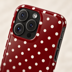 Burgundy Polka Dot protective phone case, white polka dots on deep burgundy, lifestyle close-up of the camera