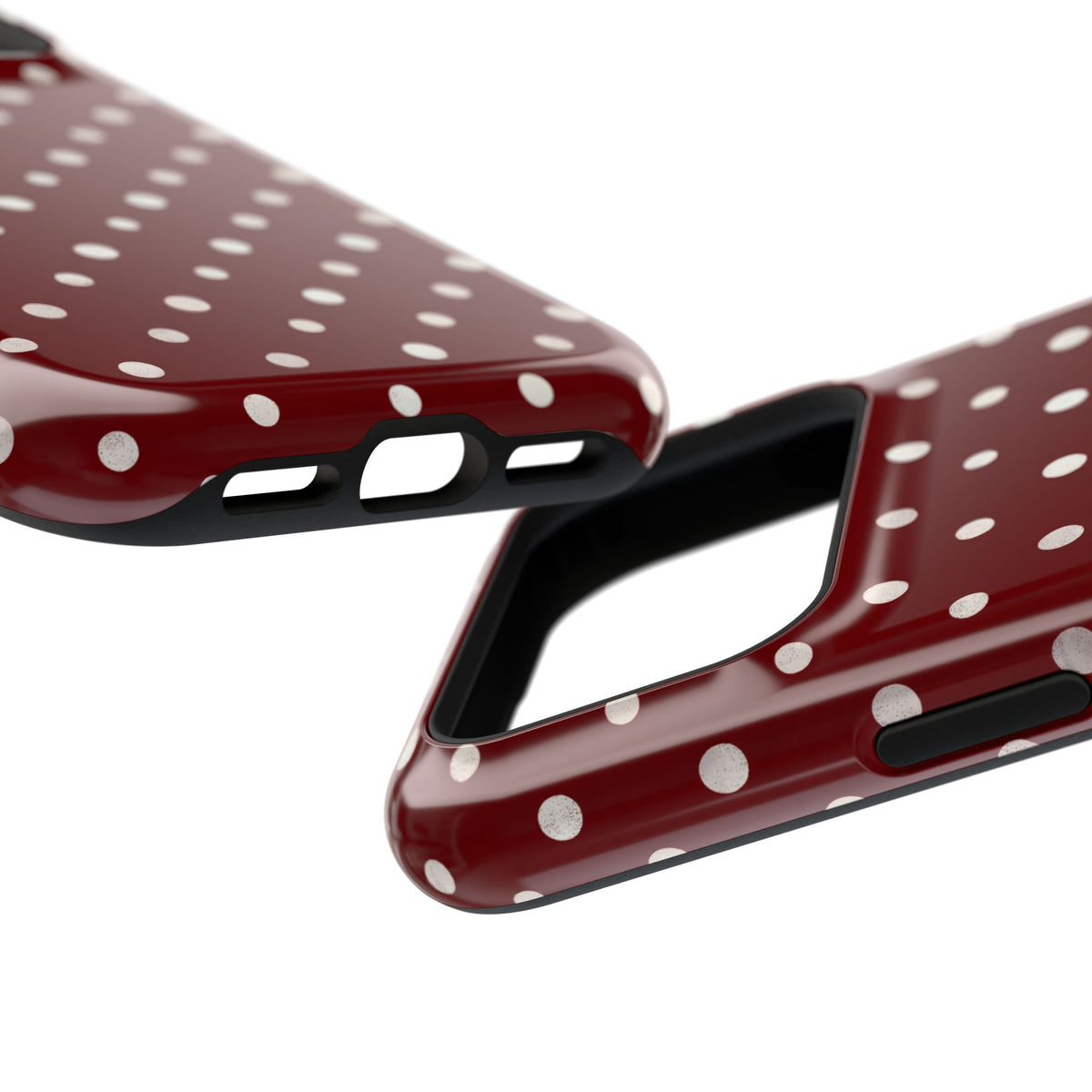 Burgundy Polka Dot protective phone case, close-up at an angle