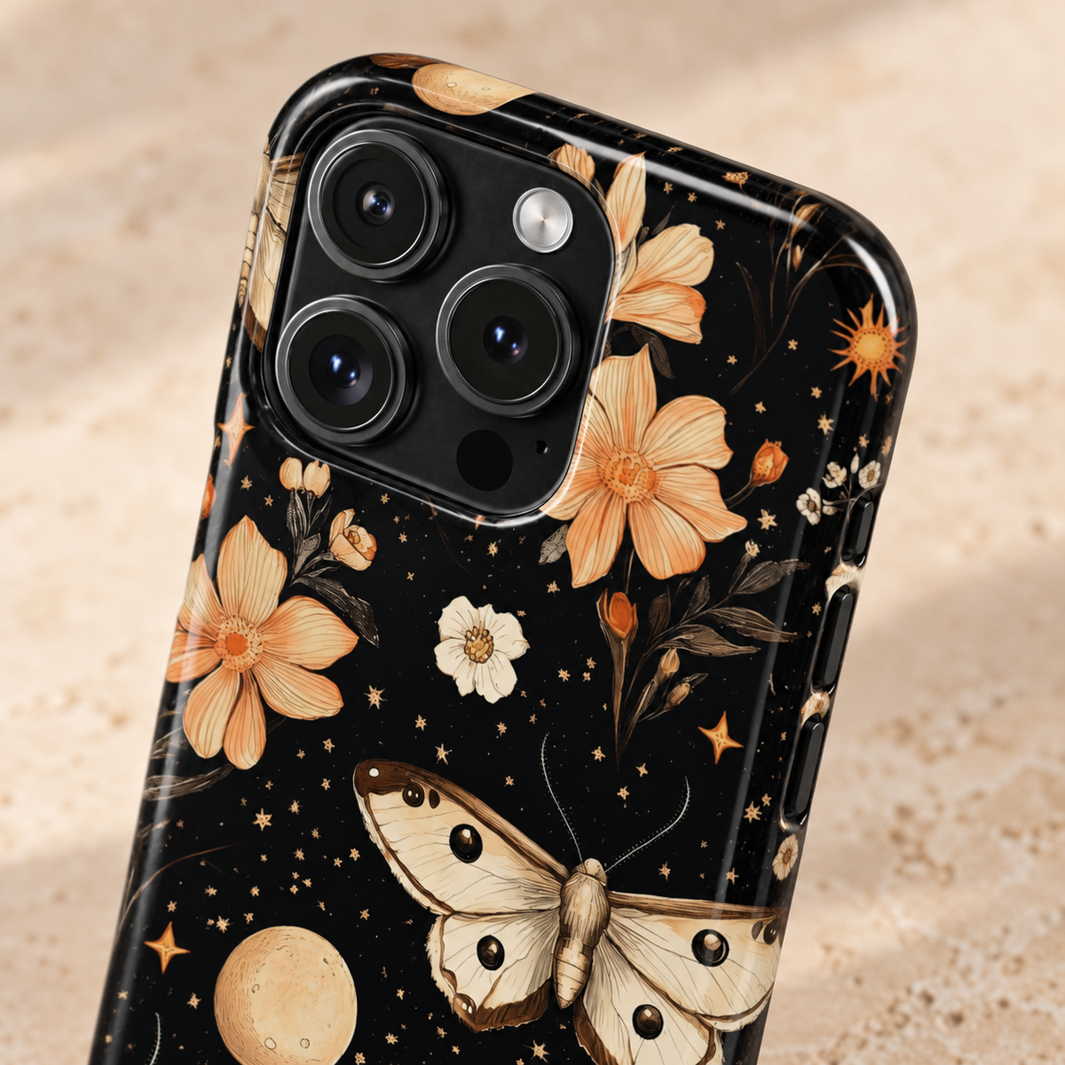 Celestial Moth protective phone case, moths, moons and peach flowers on black, lifestyle close-up of the camera