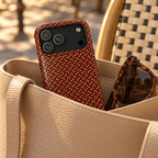 Chocolate Micro Dot MagSafe case, tiny pink dots on chocolate brown, lifestyle photo in a handbag