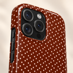 Chocolate Micro Dot MagSafe case, tiny pink dots on chocolate brown, lifestyle close-up of the camera