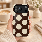 Chocolate Polka Dot MagSafe case, big cream polka dots on dark chocolate, lifestyle photo in hand with coffee