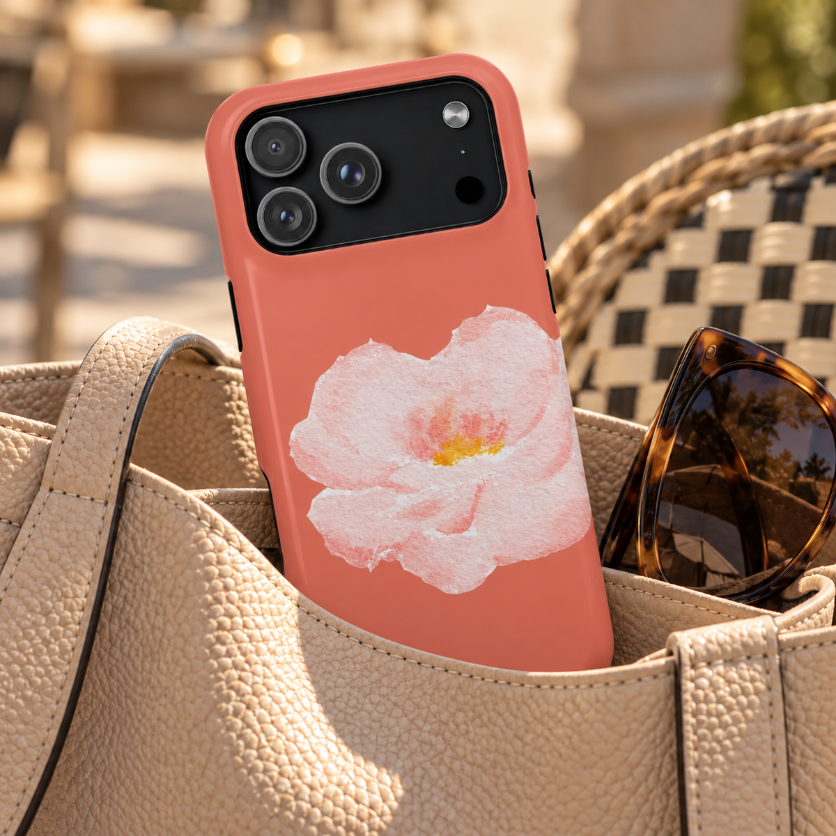 Coral Peony MagSafe case, a soft pink peony on coral, lifestyle photo in a handbag