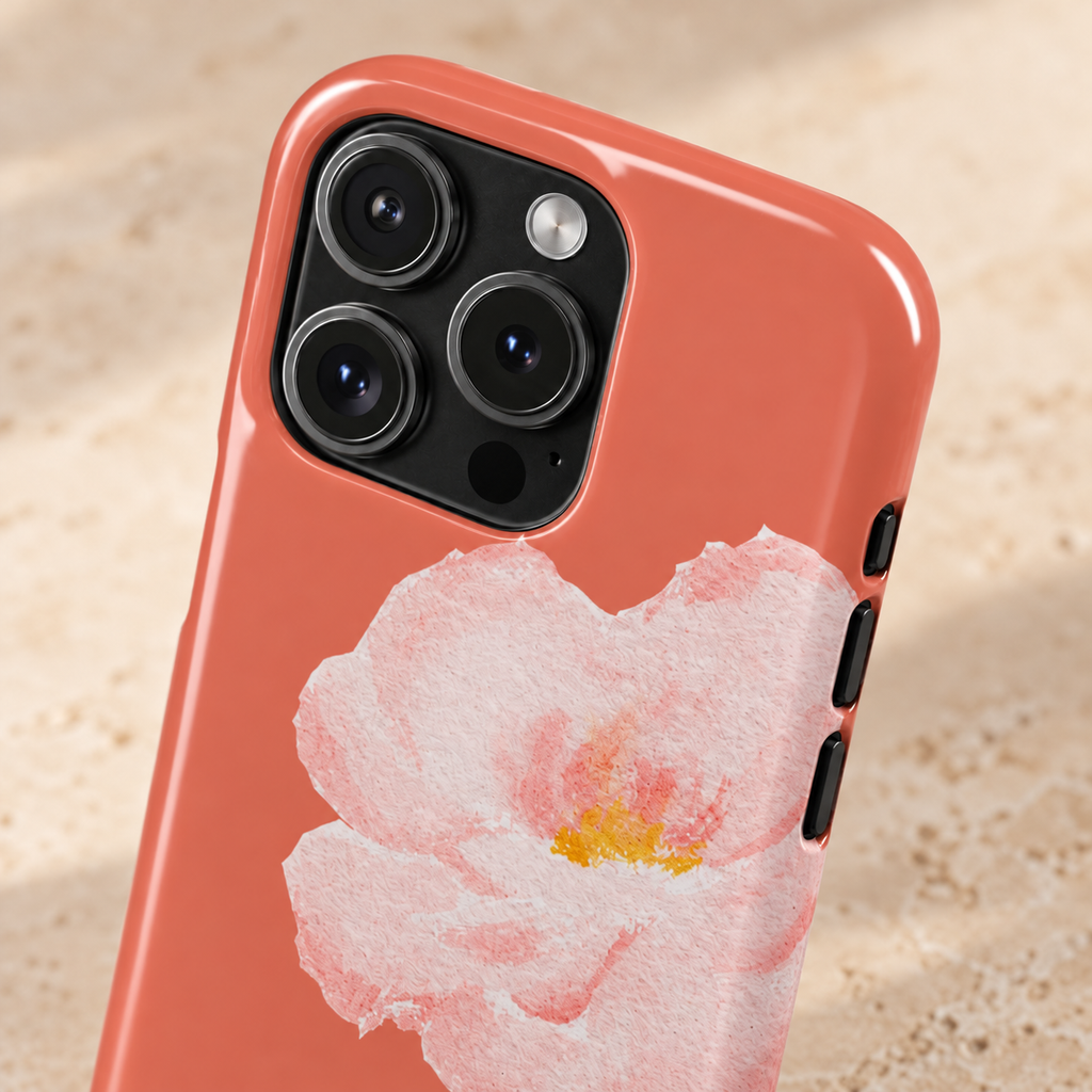 Coral Peony MagSafe case, a soft pink peony on coral, lifestyle close-up of the camera