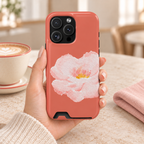 Coral Peony phone case with card holder, a soft pink peony on coral, lifestyle photo in hand with coffee