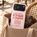 Fruit of the Spirit MagSafe case, Stay Sweet Fruit of the Spirit lettering on blush, lifestyle photo in a handbag