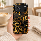 Gilded Leopard protective phone case, gold glitter leopard spots on black, lifestyle photo in hand with coffee