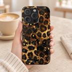 Gilded Leopard phone case with card holder, gold glitter leopard spots on black, lifestyle photo in hand with coffee