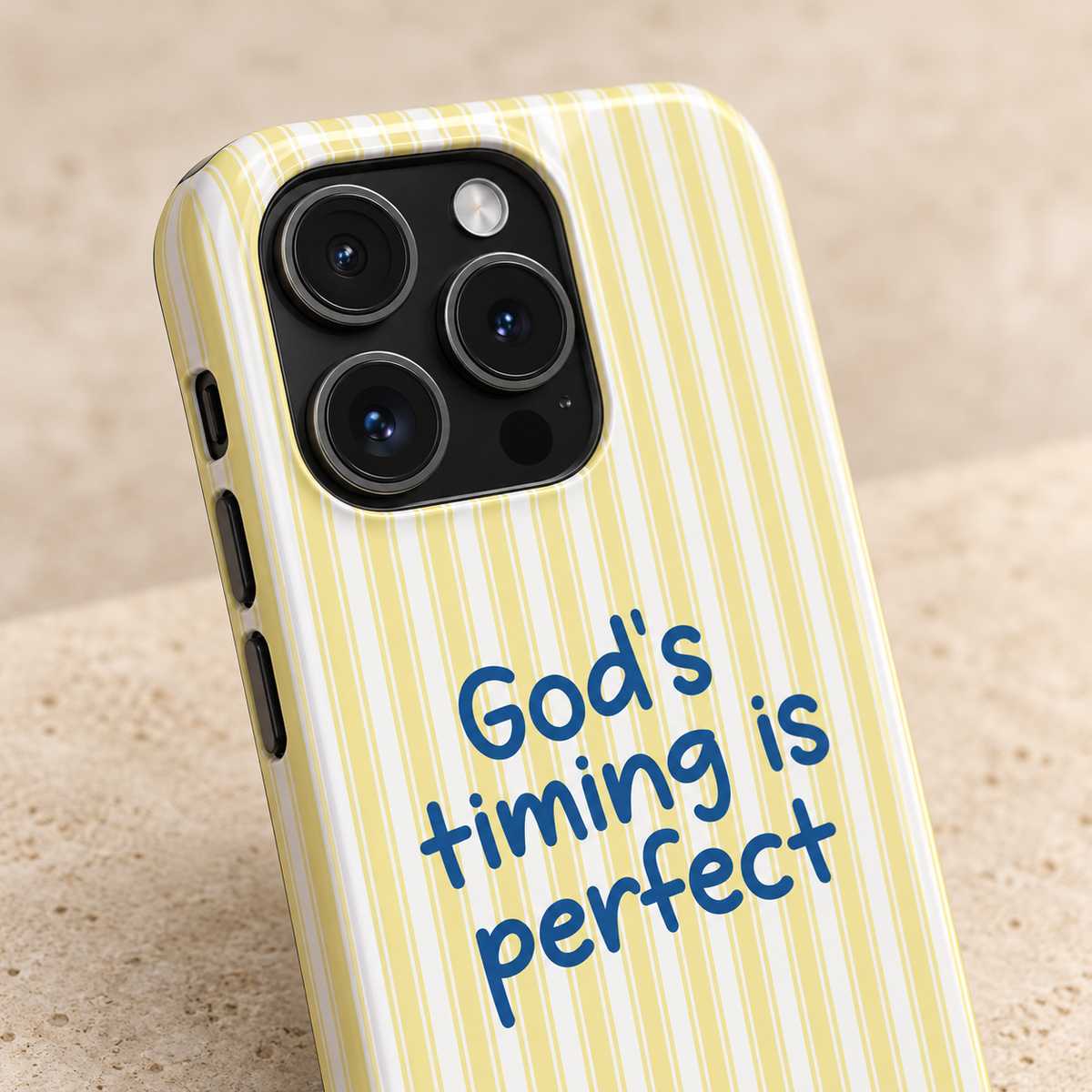 God's Timing MagSafe case, God's timing is perfect on soft yellow stripes, lifestyle close-up of the camera