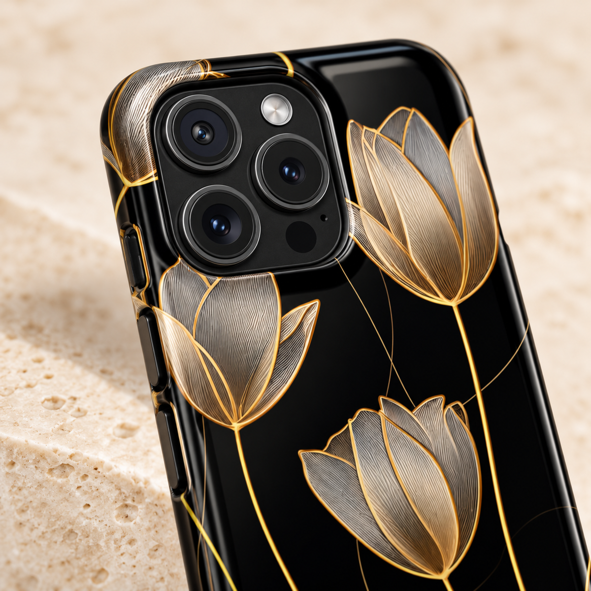 Golden Tulip MagSafe case, golden line-art tulips on black, lifestyle close-up of the camera