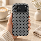 Gray Polka Dot protective phone case, black polka dots on soft gray, lifestyle photo in hand with coffee