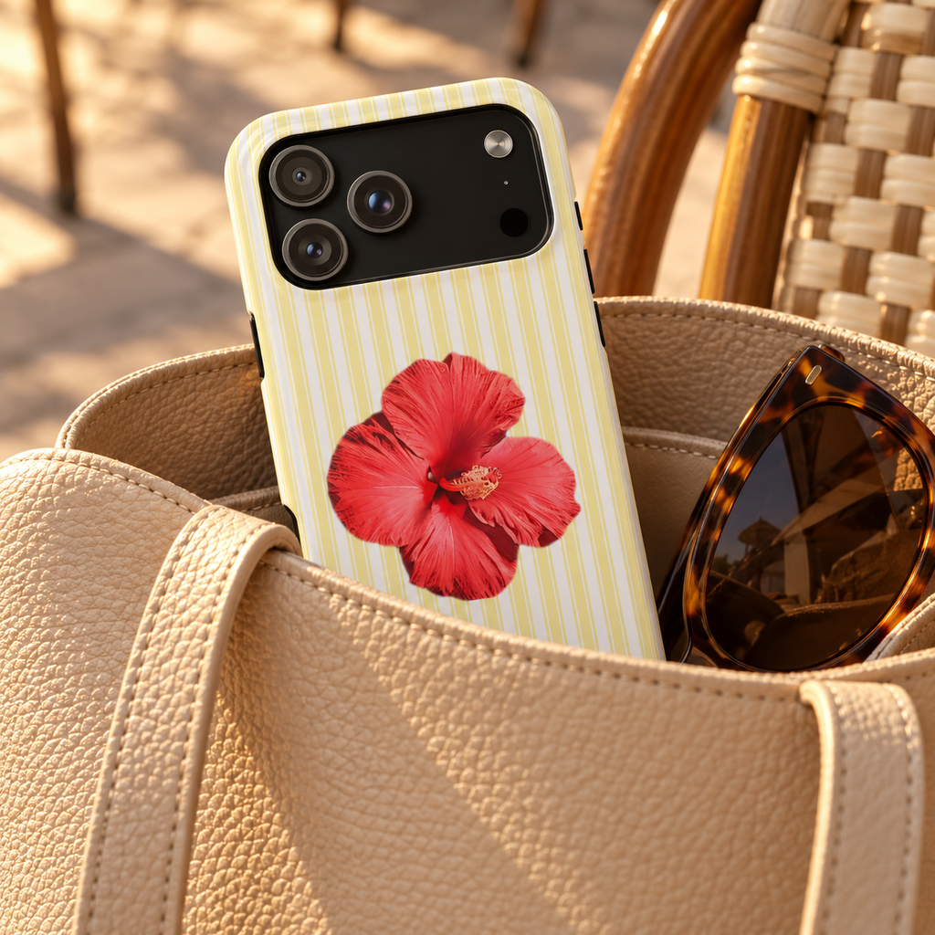 Hibiscus Stripe phone case with card holder, a red hibiscus on pale yellow stripes, lifestyle photo in a handbag