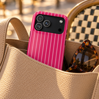 Hot Pink Stripe phone case with card holder, hot pink pinstripes, lifestyle photo in a handbag