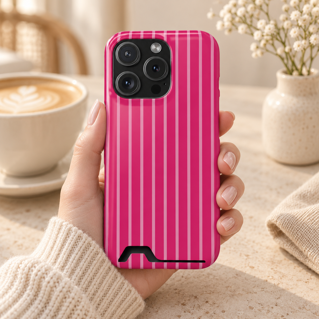 Hot Pink Stripe phone case with card holder, hot pink pinstripes, lifestyle photo in hand with coffee