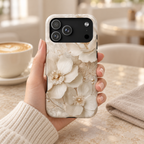 Ivory Blossom protective phone case, ivory blossoms with pearl centers, lifestyle photo in hand with coffee