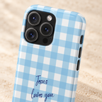 Jesus Loves You MagSafe case, Jesus Loves You script on baby blue gingham, lifestyle close-up of the camera