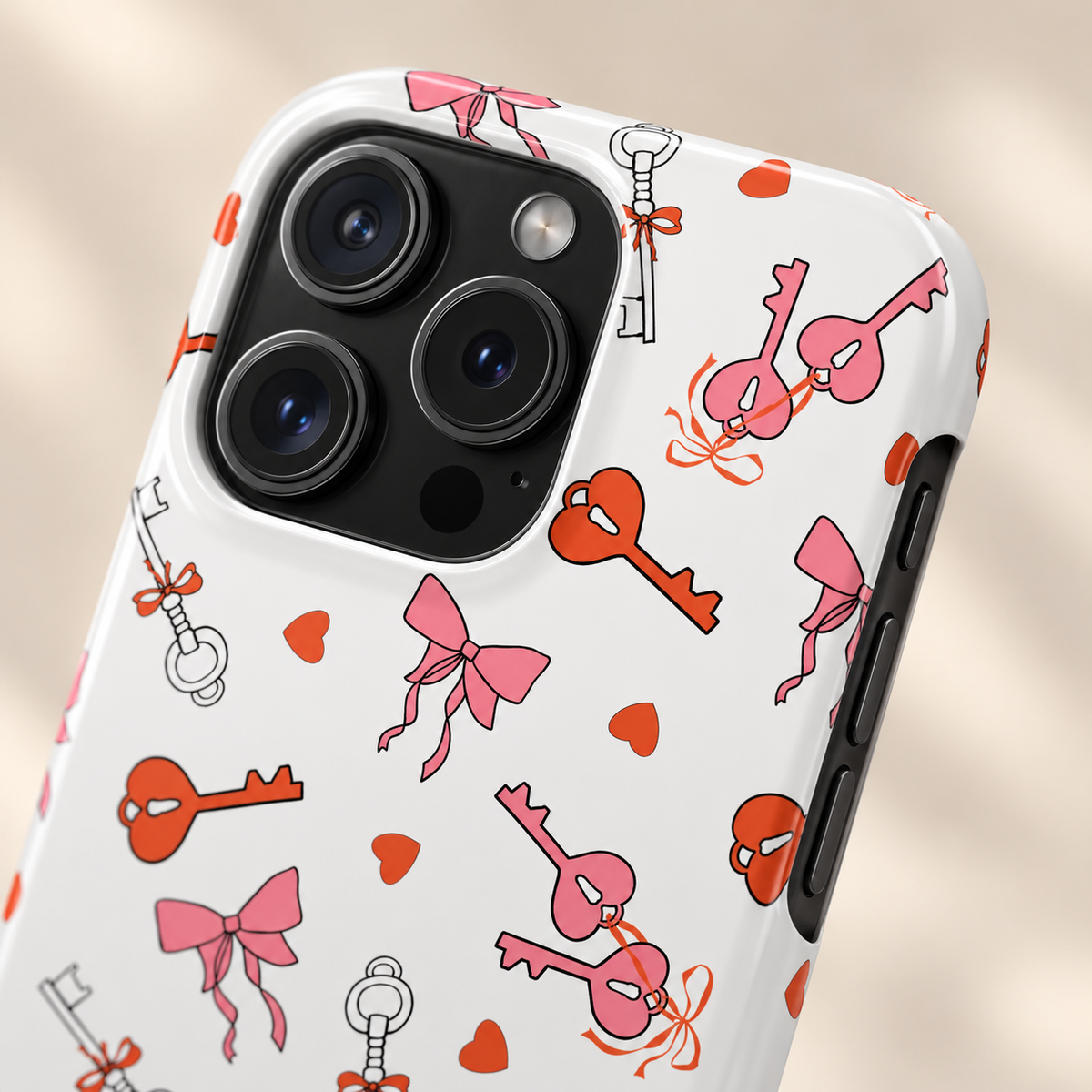 Key to My Heart protective phone case, vintage keys, little hearts and pink bows on white, lifestyle close-up of the camera