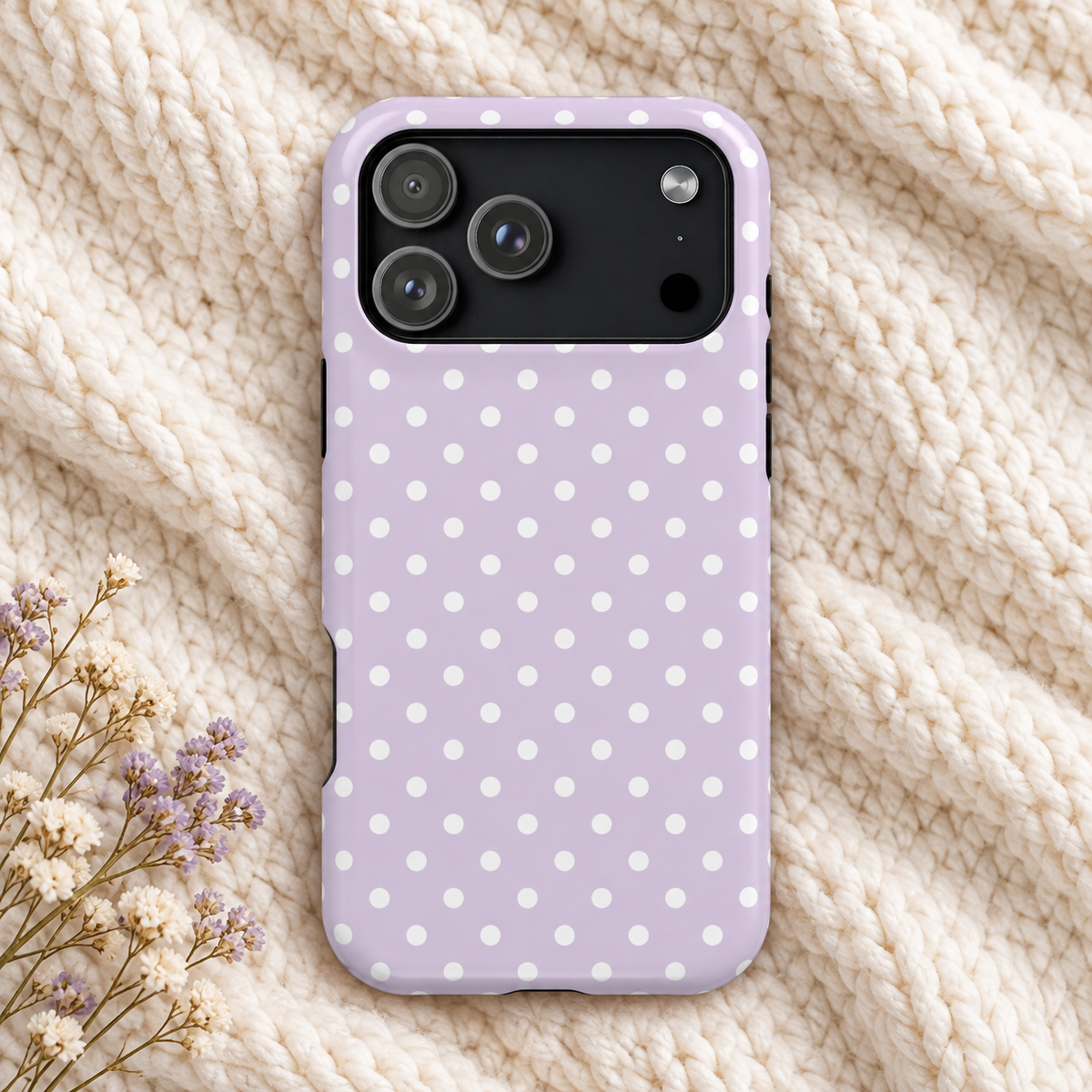 Lavender Polka Dot MagSafe case, white polka dots on soft lavender, lifestyle photo on a knit blanket