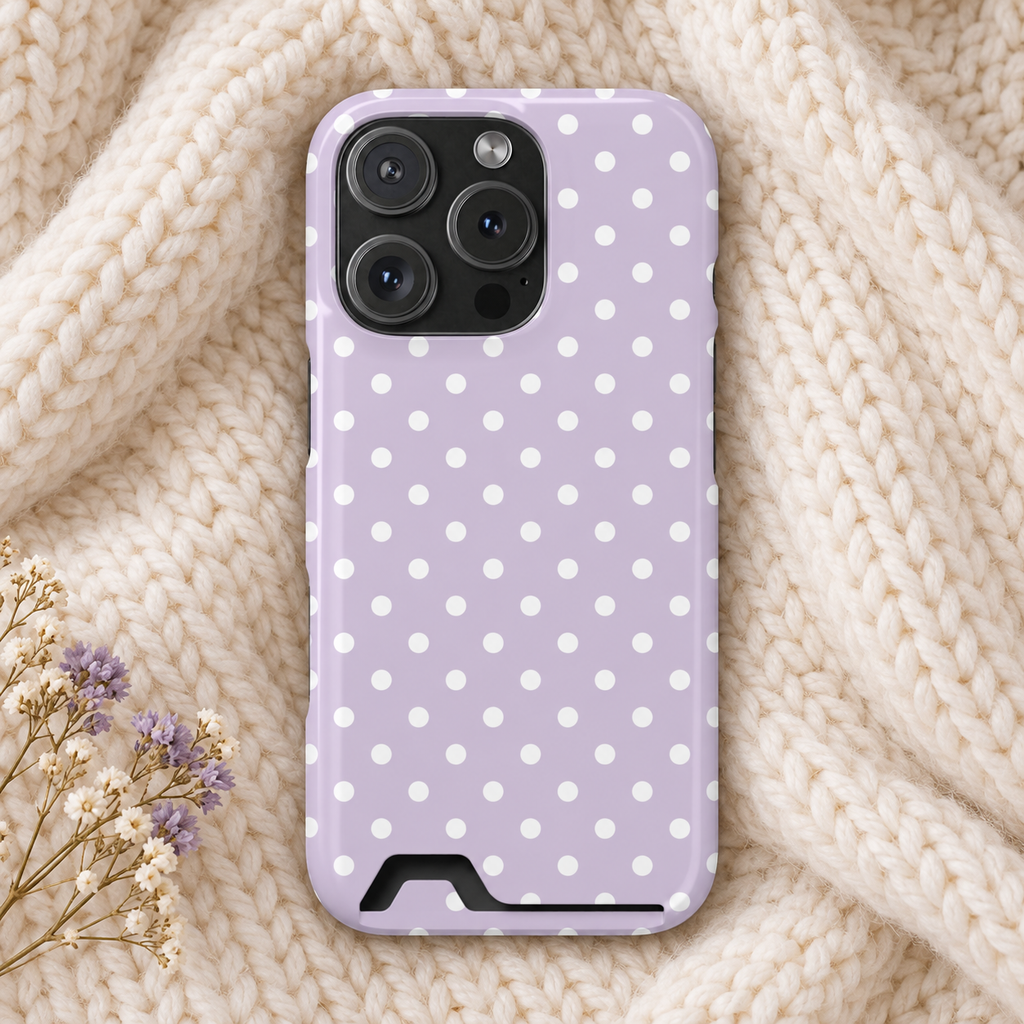 Lavender Polka Dot phone case with card holder, white polka dots on soft lavender, lifestyle photo on a knit blanket