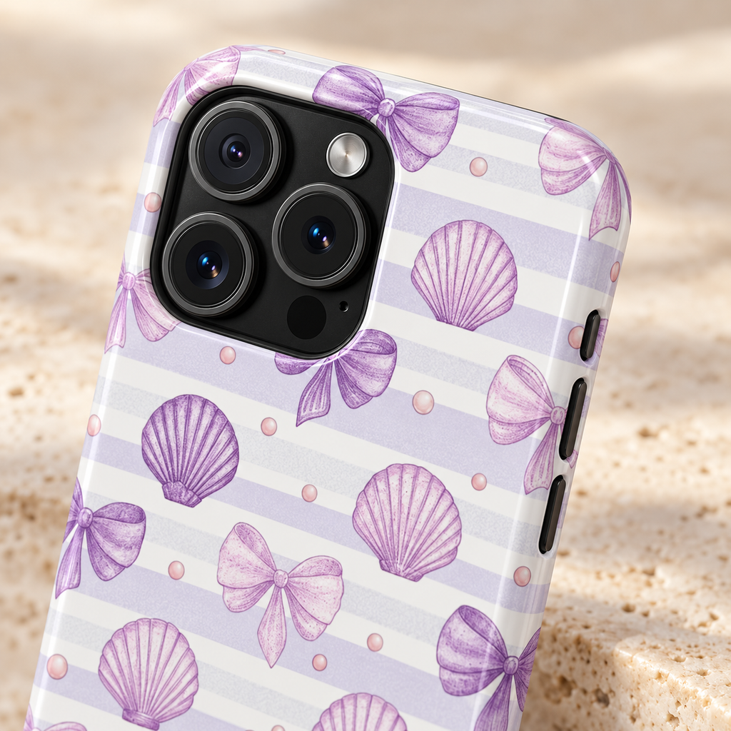 Lilac Seashell MagSafe case, lilac seashells and bows on soft stripes, lifestyle close-up of the camera