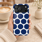 Navy Polka Dot protective phone case, big navy polka dots on white, lifestyle photo in hand with coffee