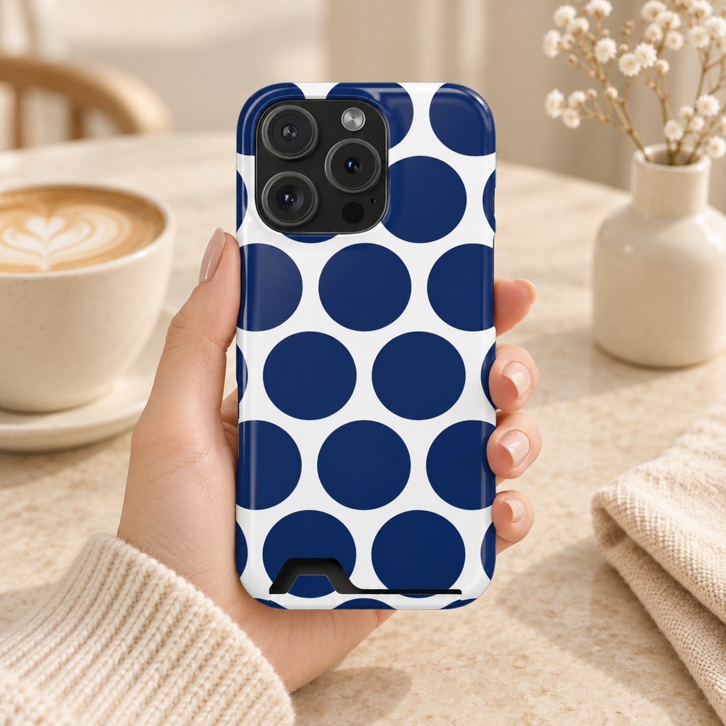 Navy Polka Dot phone case with card holder, big navy polka dots on white, lifestyle photo in hand with coffee