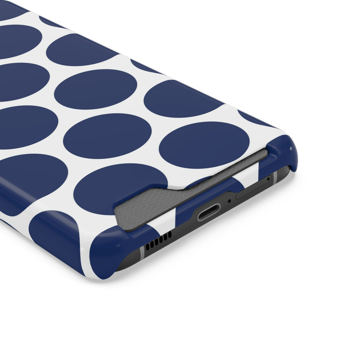 Navy Polka Dot phone case with card holder, close-up of the card slot