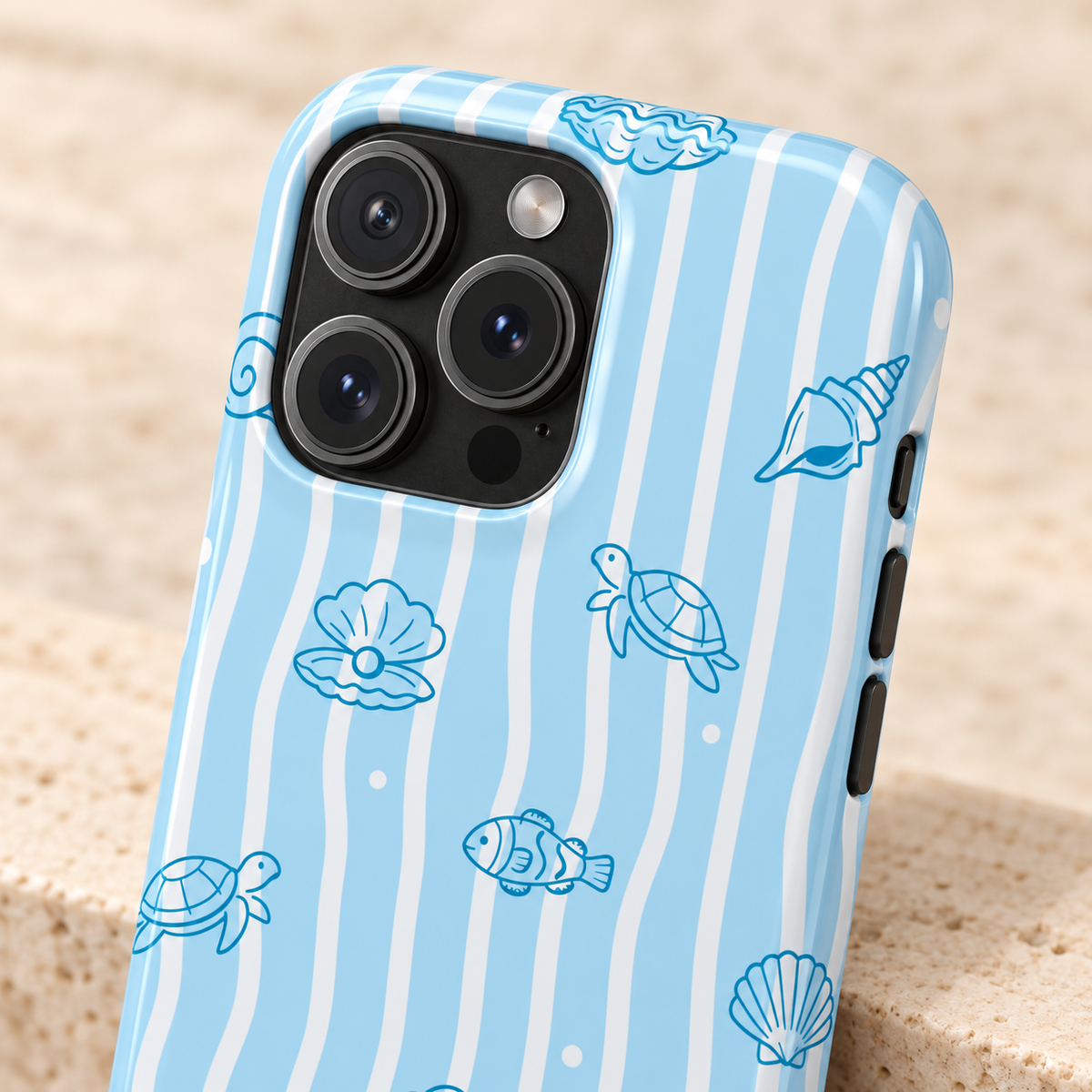 Ocean Doodle Stripe MagSafe case, seashell and turtle doodles on wavy blue stripes, lifestyle close-up of the camera