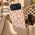 Peach Butterfly MagSafe case, little peach, coral and mustard butterflies on white, lifestyle photo in a handbag