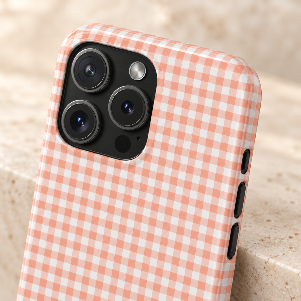 Peach Gingham protective phone case, peach gingham checks, lifestyle close-up of the camera
