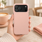Peach Gingham MagSafe case, peach gingham checks, lifestyle photo in hand with coffee