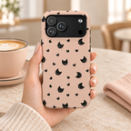 Peach Kitty protective phone case, little black cats on peach, lifestyle photo in hand with coffee