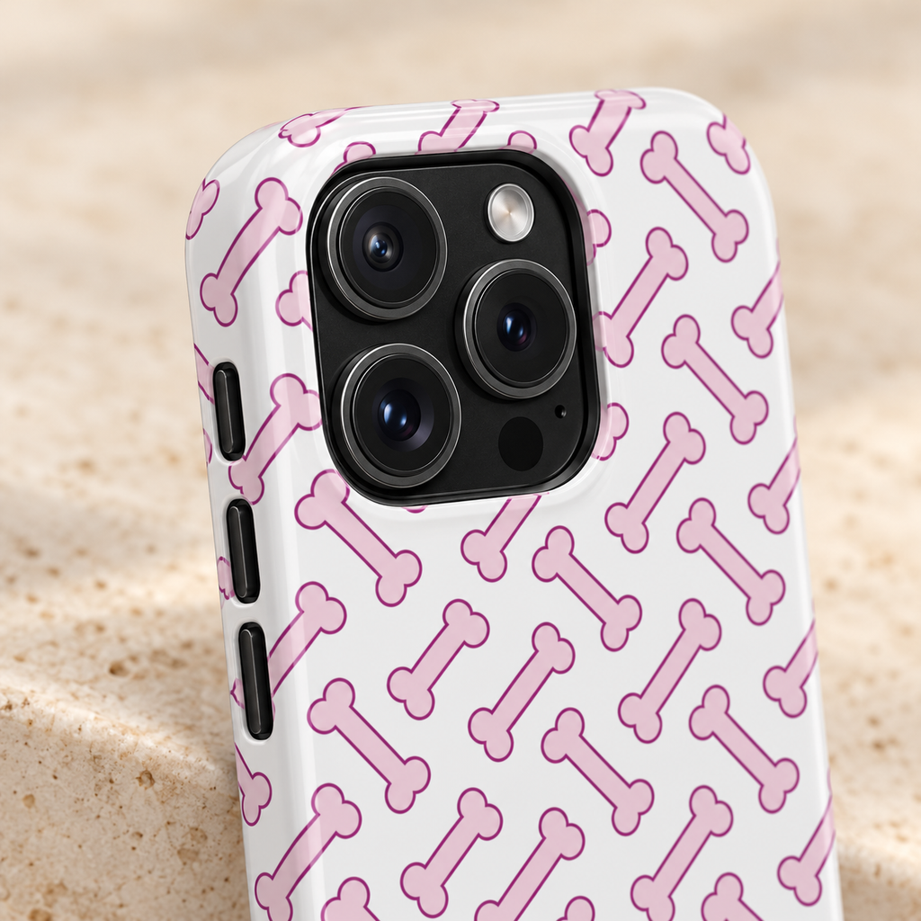 Pink Dog Bone MagSafe case, pink dog bones on white, lifestyle close-up of the camera