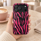 Pink Glitter Zebra MagSafe case, hot pink glitter zebra stripes on black, lifestyle photo in a handbag