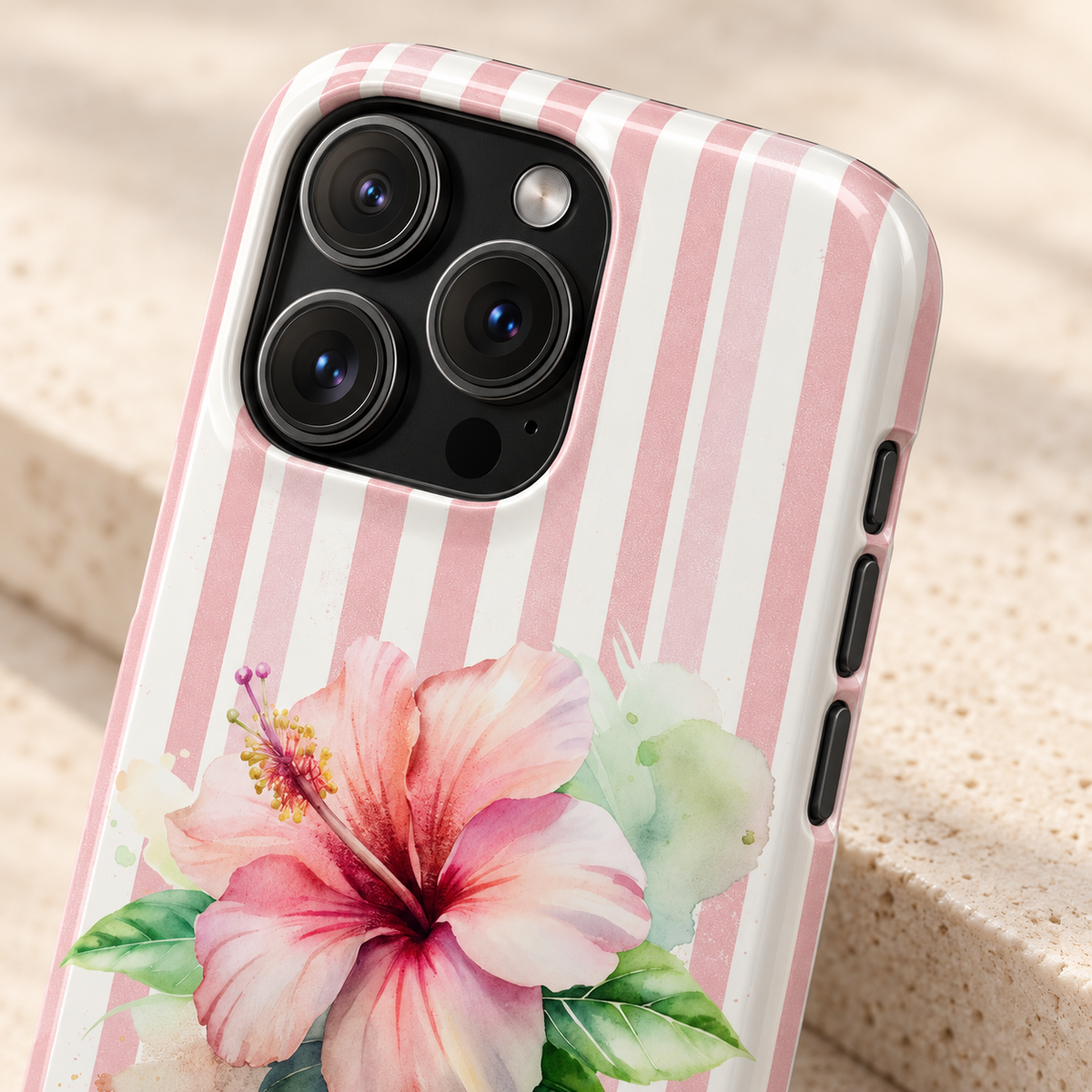 Pink Hibiscus protective phone case, a pink hibiscus on blush stripes, lifestyle close-up of the camera