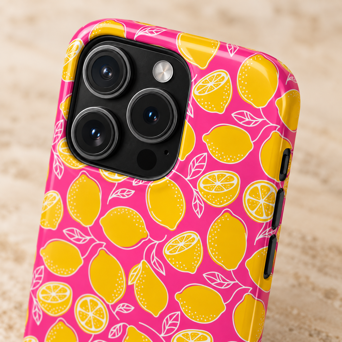 Pink Lemonade MagSafe case, yellow lemons on hot pink, lifestyle close-up of the camera
