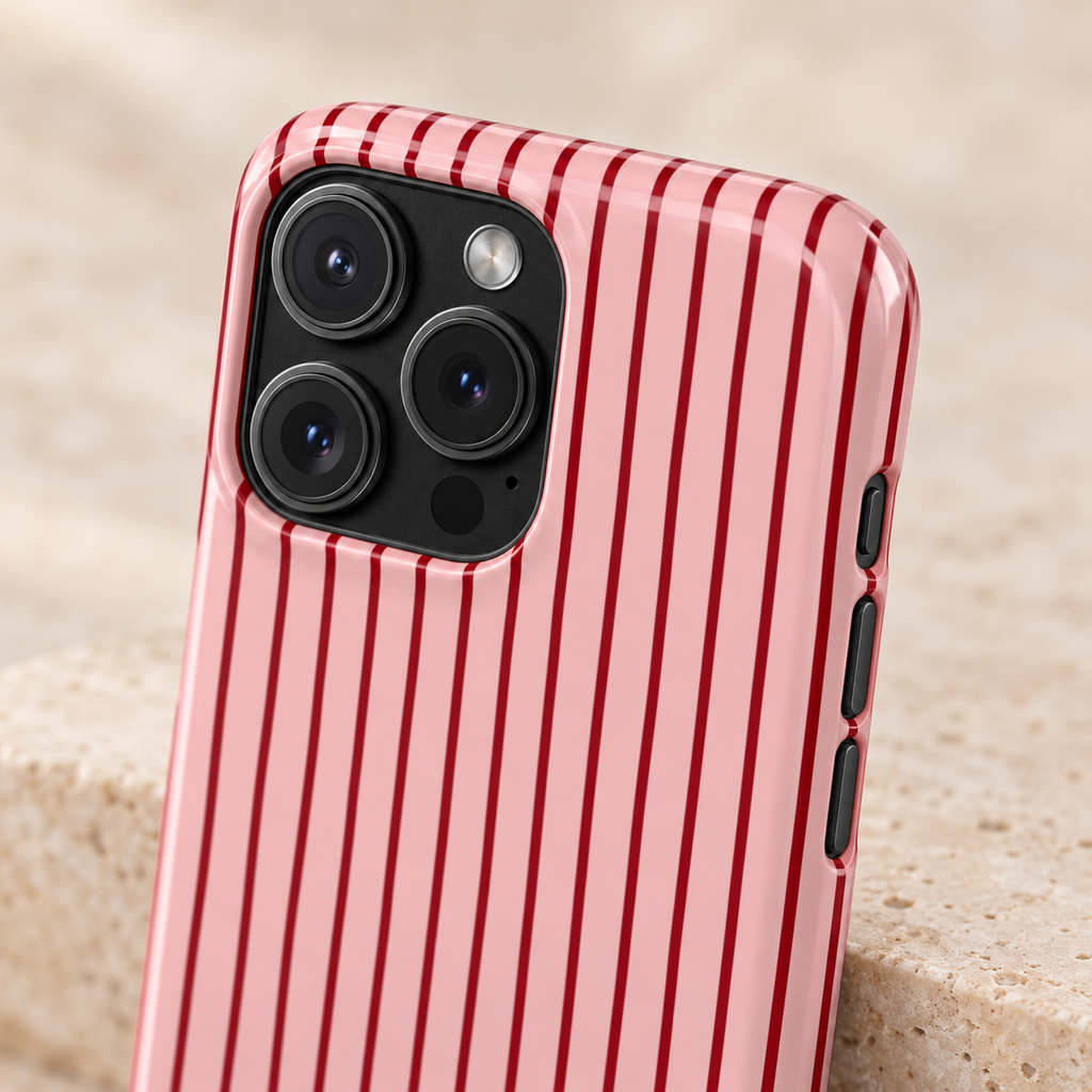 Pink Pinstripe protective phone case, black pinstripes on pink, lifestyle close-up of the camera