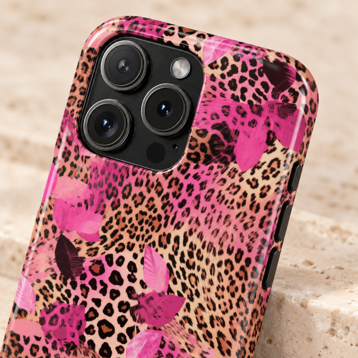 Pink Splash Leopard protective phone case, pink brushstrokes over classic leopard, lifestyle close-up of the camera
